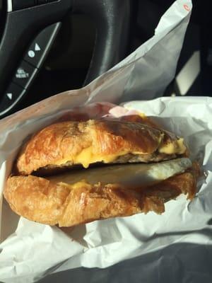 Sausage , egg , and cheese on a crossiant