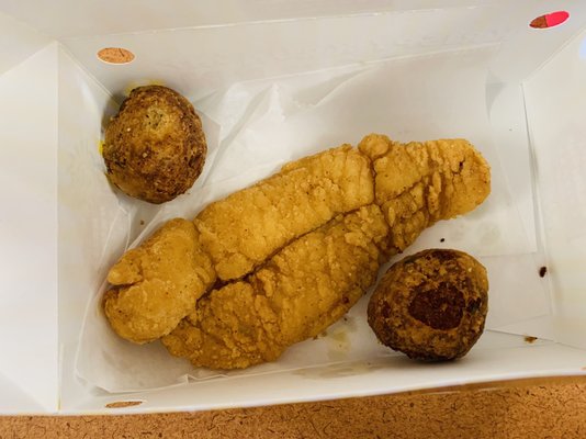 Cajun fish and two boudin balls.