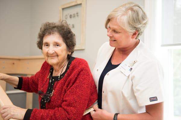 Michelle the Physical Therapist training a patient on the stairs.