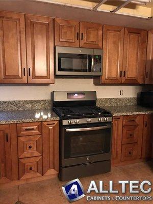 Coffee Raised Panel Cabinets with New Venetian Gold Granite