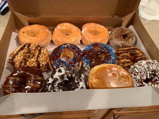 Classic glazed, blueberry, snickerdoodle, chocolate frosted with sprinkles, Twix, Oreo, caramel apple, coconut cake