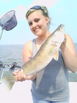 Sara with a Lake Erie walleye - her first time out