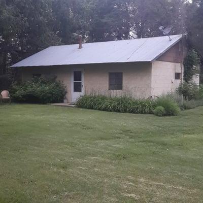 Exterior of the house. Has living room, full kitchen, bathroom, and one bedroom with a king and two twins.