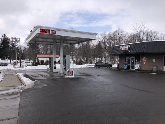 Street view of the shop and gas pumps.