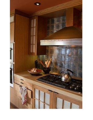 The Fong kitchen has a combination of shoji doors, with some backlit and bamboo faces on cabinets.