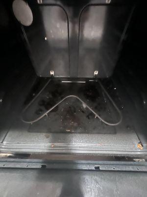 Before photo of an oven before we deep cleaned it