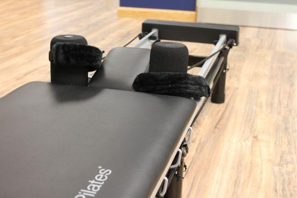 Pilates reformer to provide core strengthening and gentle exercise to help people recover from injuries.