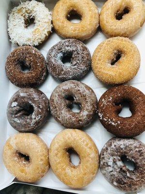 A dozen donuts. Some flavors I recall were coconut, plain glazed, molasses, molasses glazed, chocolate, and cinnamon sugar.