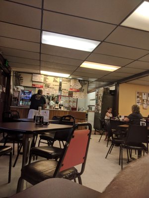 Bare bones dining room, with a homey feel.