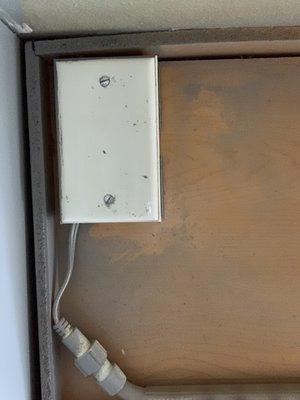 Significant overspray on electrical boxes and undercabinet lighting.