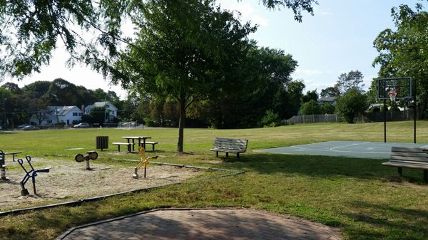 half basketball court, soccer goals, baseball field.