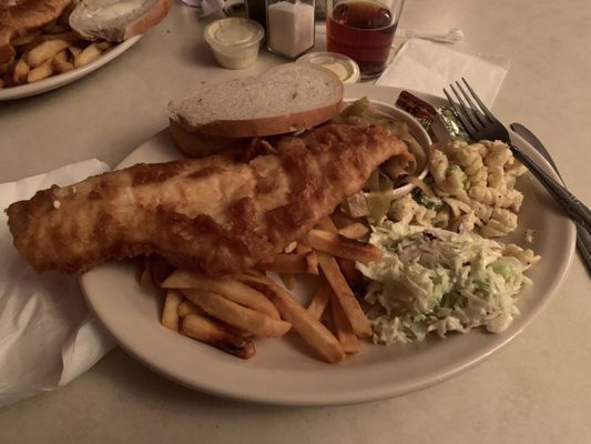 Beer batter fish fry with sweet and sour cabbage, macaroni salad. Coleslaw  and fries