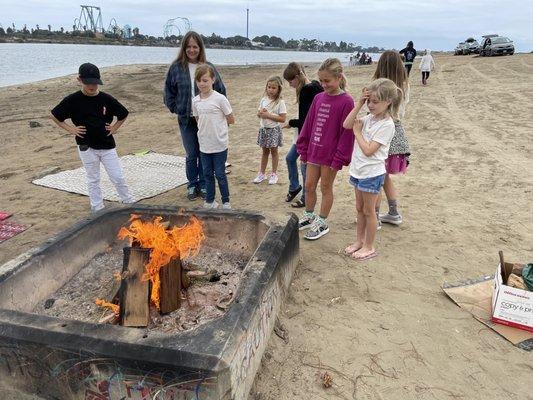 Survive skills session 2. Students learning to build fires and cook food.