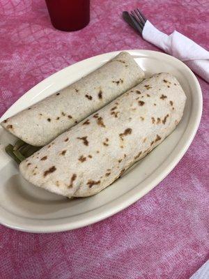 Breakfast tacos : the world's best flour tortillas stuffed with chorizo and eggs and nopalitos