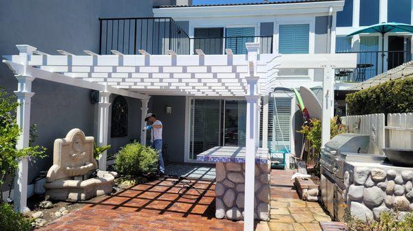 Newly waterproofed upstairs deck with new vinyl pergola