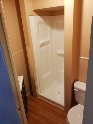 Full bathroom remodel including new shower enclosure framing and finishing.