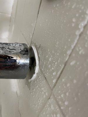 Gap between tub faucet and wall