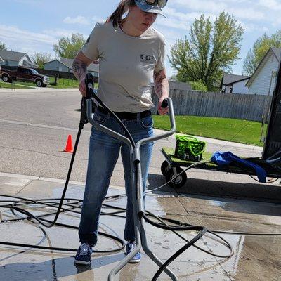 Crysta running the surface cleaner on this driveway