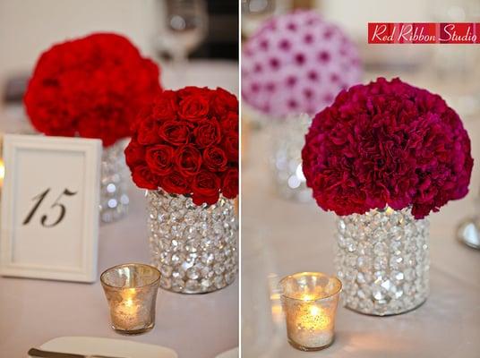 Roses, Mums, and carnations massed tightly on bejeweled holders (Red Ribbon )