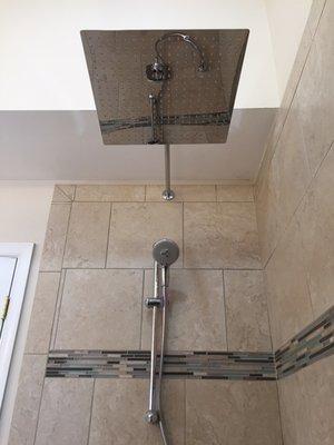 A shower rain head was added, along with a removable shower head on a sliding bar.