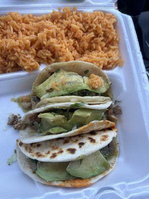 Steak tacos with avocado, cilantro and onions