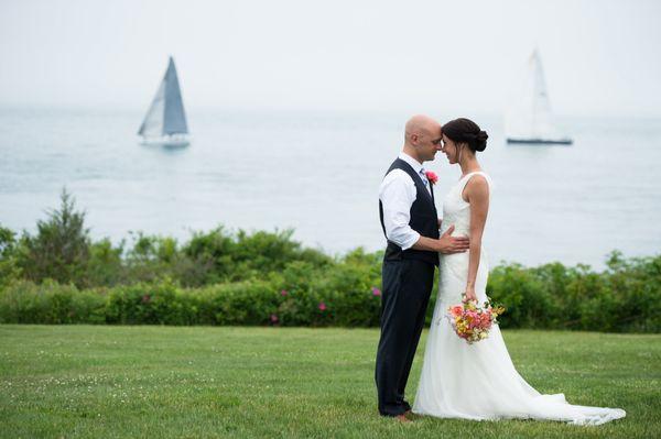 Bride and groom share a moment near the water in Portland, Maine