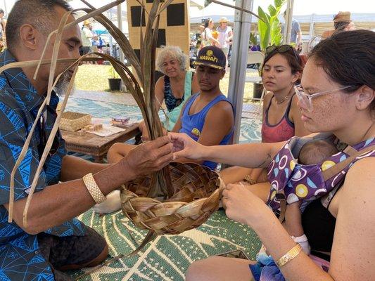 Kumu Mario teaching us how to weave a bowl/hat