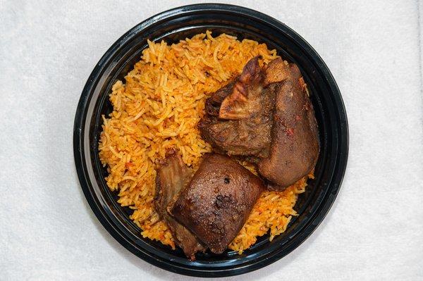 Jollof Rice and Chicken! Comes with steamed vegetables