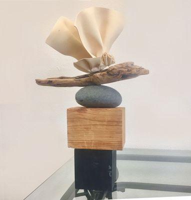 Joan Rosenberg-Dent porcelain sculpture on rock and wood