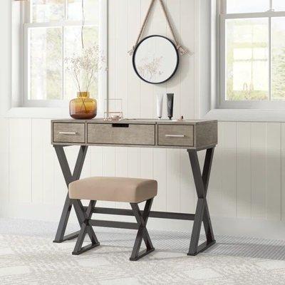 Sauder lite wood, has 3 drawers, one just for smaller apartments. Also makes an excellent vanity