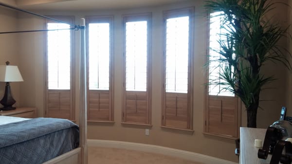 Wood shutters are versatile, providing privacy below while allowing light and a view above the divider rail.