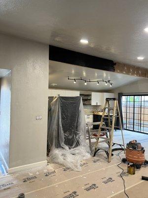 Installation of beam to open up kitchen area.