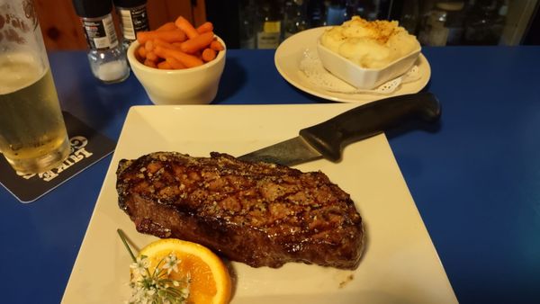 20oz NY strip with carrots and cheesy mashed potatoes.