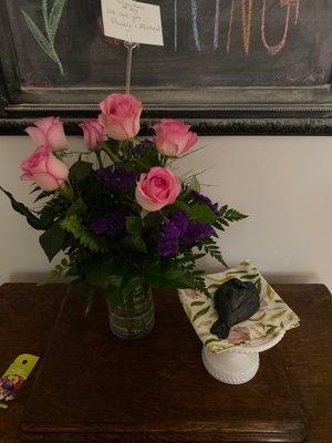 Second arrangement w pink roses but no blue delphimium or cream colored flowers.