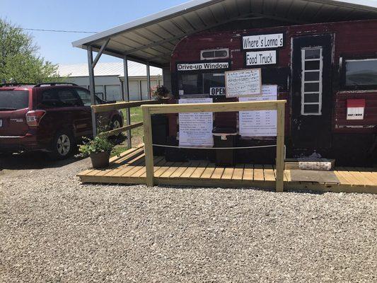 Drive up window at the new deck that surrounds the food truck with seating in the back during summer