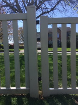 Tire marks along fence. Gate knocked of hinges from fence.