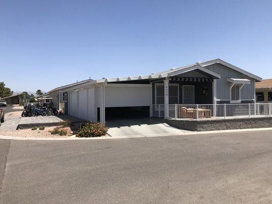 Driveway and carport turned garage with Roll-A-Shield shutters!