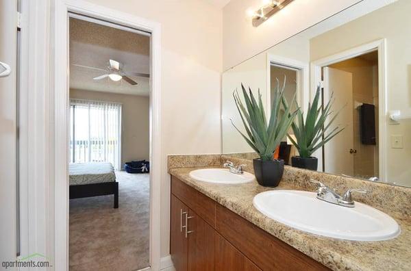 Spa inspired bathrooms with double vanity sinks.