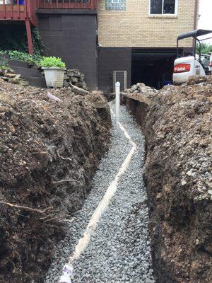 Installation of sanitary sewer at residence