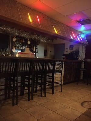 Cool tiki type bar with moving lights.