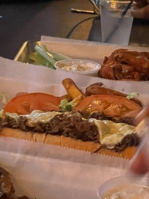 cheesesteak (buffalo wings in back)