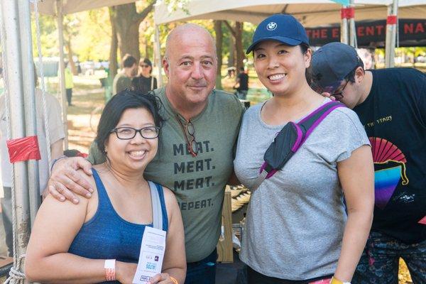 Andrew Zimmern flanked by Jaci and Jackie