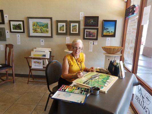 One of our members painting at the gallery.