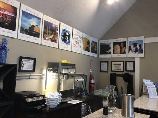 Inside the tasting room, wine bottle labels made into wall art and popcorn offered during tastings.