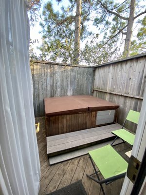 Door from bedroom leads to this hot tub on private patio.