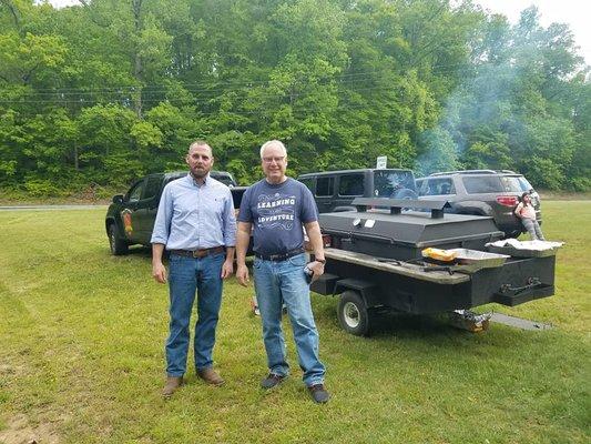 Executive Director Tim White and Superintendent of Stafford County Public Schools serve dinner together in Widewater at a community cookout.