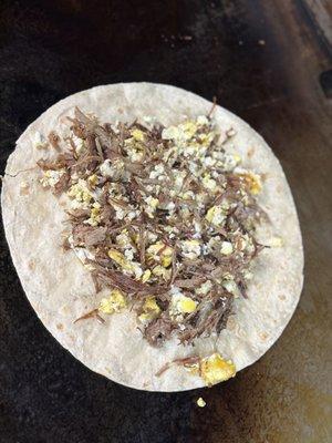 Brisket and eggs burrito