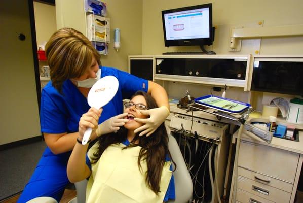 Tricia, one of our dental hygienists, loves helping young patients understand their dental health!