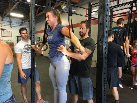 Athletes helping each other during drills