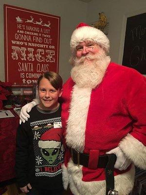 Santa spreading Holiday cheer at a private Christmas party